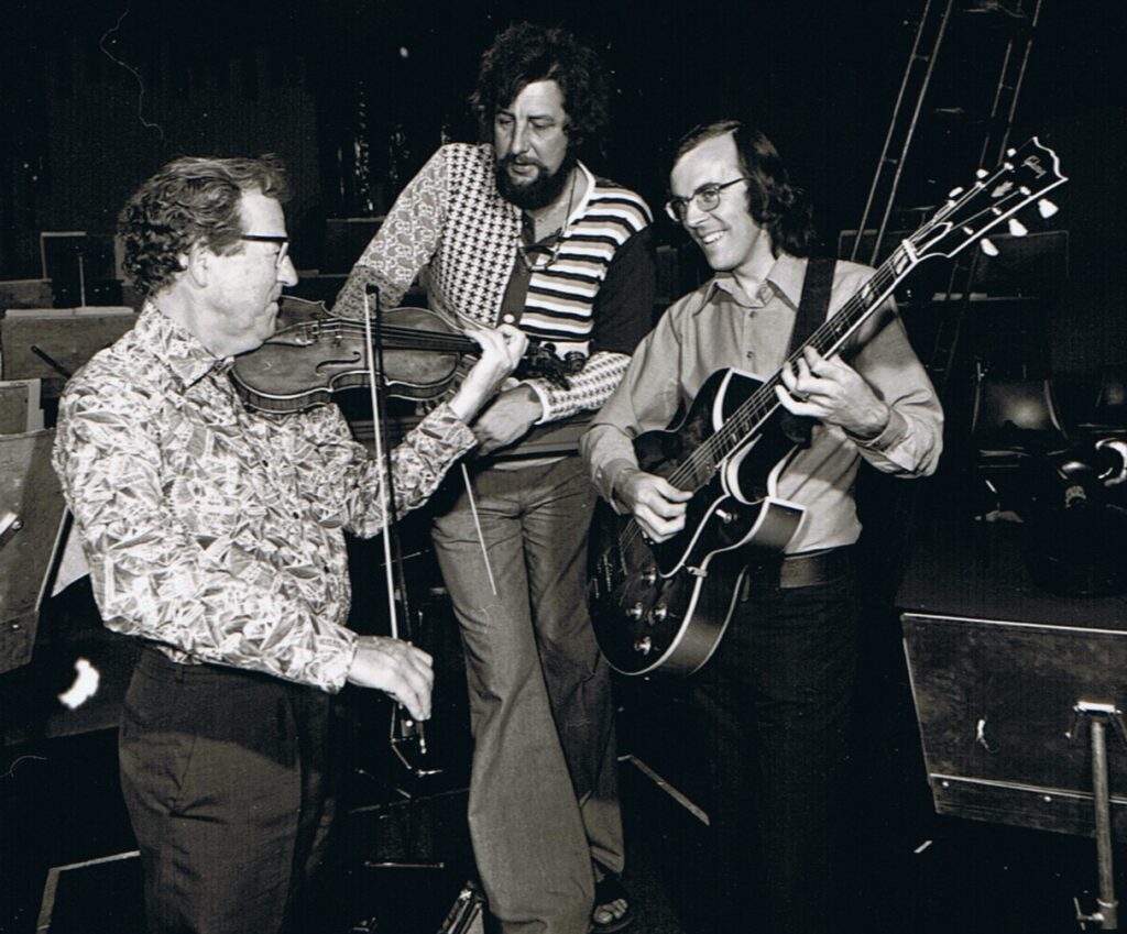 "Pop Goes the Weasal" WASO - conductor David Measham with Concertmaster Vaughan Hanly and guitarist Ray Walker